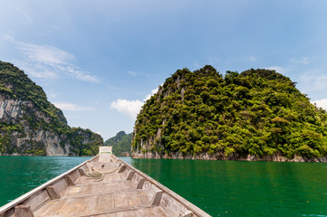 Naklejka premium Longtail boat at Cheow Lan Lake, Thailand