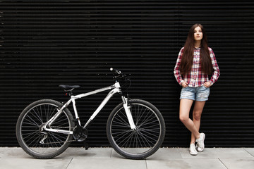 Naklejka na ściany i meble Young beautiful woman on a bicycle