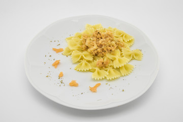 italian pasta called butterflies with shrimp salmon and basil