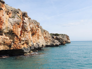 Fototapeta na wymiar Picturesque Red Rocks On The East Coast of Majorca Island