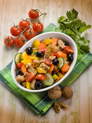 panzanella mixed salad with nuts and sliced bread