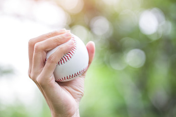 Close-up of player's hand holding baseball