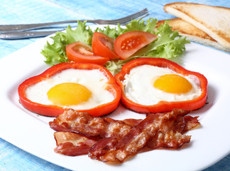Breakfast fried eggs, bacon, tomatoes and lettuce