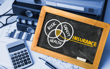 insurance concept hand drawing on blackboard