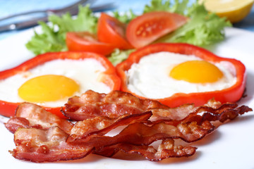 Breakfast fried eggs, bacon, tomatoes and lettuce