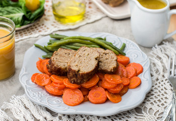 Italian veal meatloaf polpettone with carrots and sauce