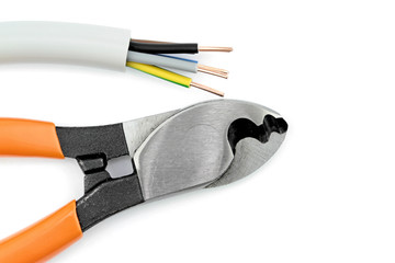 Electric cable and cutter on  white background.