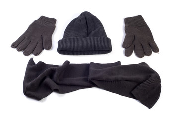 Winter cap, scarf and gloves isolated on white background