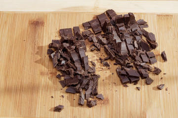Crushed dark chocolate on a cutting board
