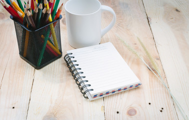 Coffee cup note book and pencil on wooden background - Vintage e