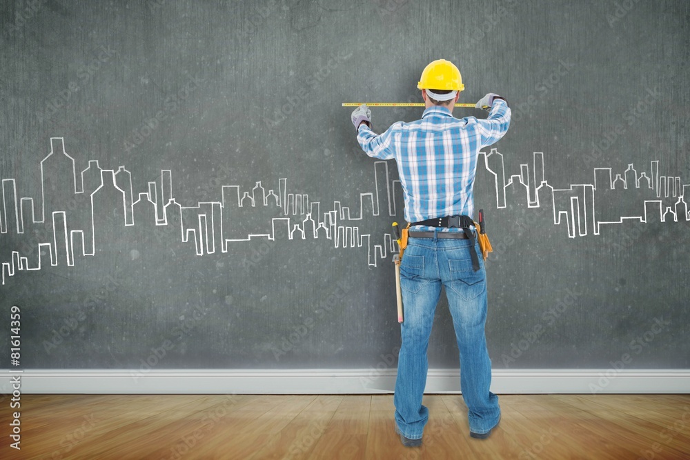 Poster construction worker using measure tape