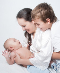 Portrait baby with happy family on light background