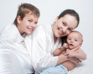 Portrait baby with happy family on light background