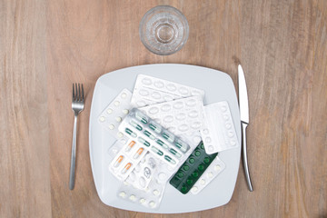 Fototapeta na wymiar A Pills on a plate as food supplement