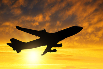 Airplane silhouette in the sunset