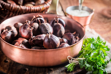 Closeup of fresh chestnuts. with parsley