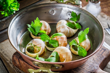 Cooking snails. with garlic butter and parsley