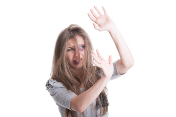 Abused and scared woman protecting herself