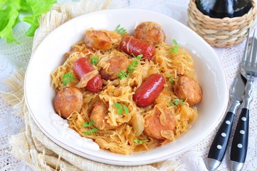 Roasted sausages with stewed cabbage