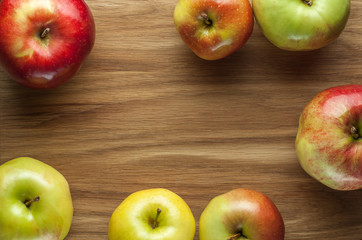 Apples on wooden background