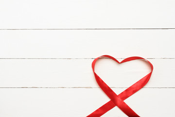 White background with heart shaped ribbon