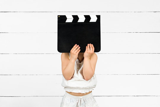 Kid with clapper board