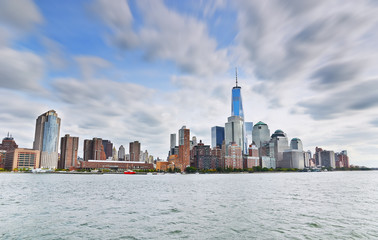 View of New York City with cloudy sky.