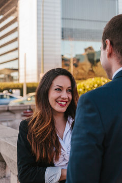 Business Couple Talking in the Street