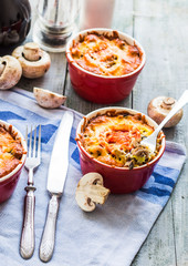 Baked mushroom julienne potatoes and tomato with cheese, lunch