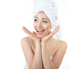 Fresh clean beautiful smiling woman wrapped in bath towels. Heal