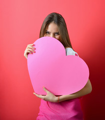 Love and valentines day woman holding heart and smiling over pin