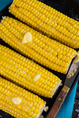 close view on Homemade golden corn cob with butter and salt