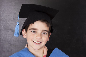 child with graduation gown isolated