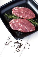 Raw fresh meat on pan