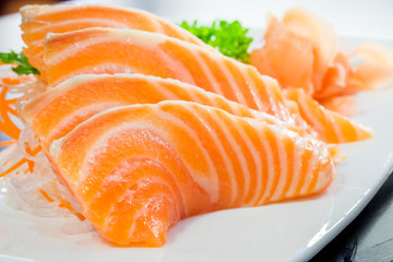 Salmon sashimi or shake / sake served with preserved ginger