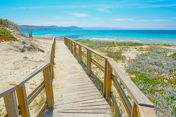 wooden boardwalk to the beach in Capo Testa