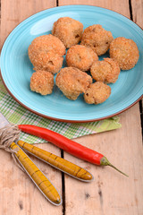 meat chop on blue plate with red pepper