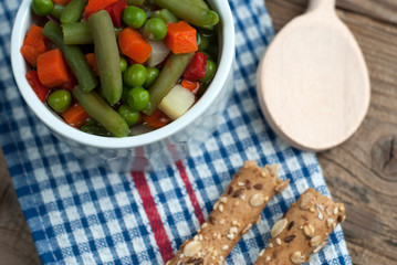 Vegetable soup on old wooden table