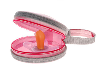 Pink baby's pacifier with box isolated on white background