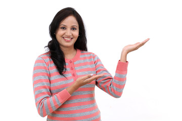 Young Indian woman showing blank copy space