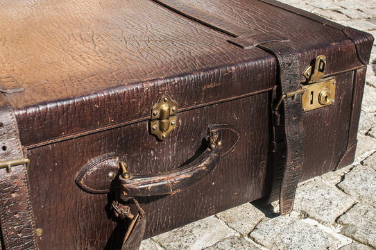 Old retro leather suitcase detail closeup