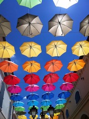 colours umbrella in blue sky
