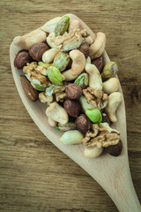 Varieties of nuts: cashew, pistachio, almond.