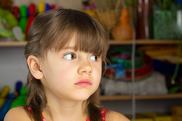 6 years old girl blond hair, red dress with white polka dots