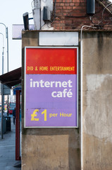 Sign for 'Internet cafe' and DVD & Home Entertainment on edge of