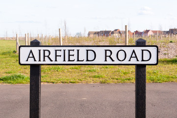 Airfield road sign on a wooden post