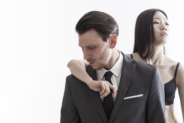 Handsome businessman and beautiful chinese model couple