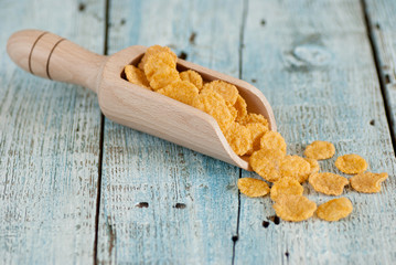 Corn flakes on old wooden table