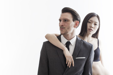 Businessman looking aside and chinese model