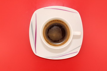 Isolated traditional Turkish coffee on a red background